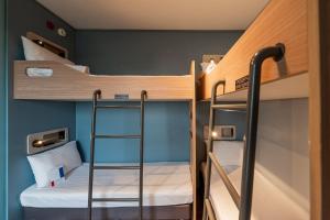 Ibis Budget Guarulhos Aeroporto客房内的一张或多张床位