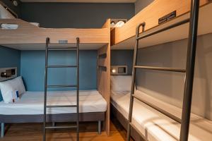 Ibis Budget Guarulhos Aeroporto客房内的一张或多张床位