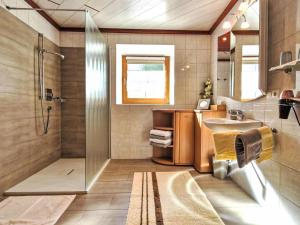 a bathroom with a shower and a sink at Apartment Lueg ins Land by Interhome in Reith bei Seefeld