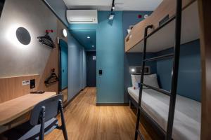 Ibis Budget Guarulhos Aeroporto客房内的一张或多张床位