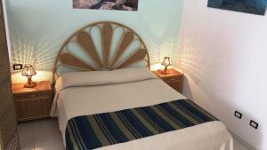 Ένα ή περισσότερα κρεβάτια σε δωμάτιο στο La Mia Isola