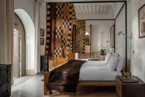 Uma cama ou camas num quarto em Riad Jaaneman