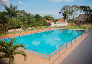 an overhead view of a large swimming pool at Forest Park Resort in Buloba