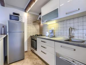 Kuchyň nebo kuchyňský kout v ubytování Apartment Olivo-1 by Interhome + 30 fotografií