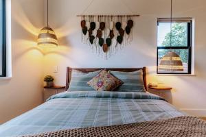 a bedroom with a bed and two windows at Central SD, Luxury Home and Casita, Pool, BBQ, Sleeps10 in La Mesa +74 photos