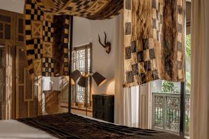 Uma cama ou camas num quarto em Riad Jaaneman