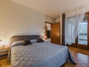 Postel nebo postele na pokoji v ubytování Apartment Serafini by Interhome