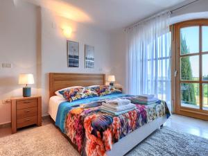 Katil atau katil-katil dalam bilik di Holiday Home Diana by Interhome