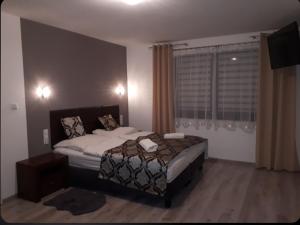 Posteľ alebo postele v izbe v ubytovaní Apartament Glamour