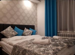 Posteľ alebo postele v izbe v ubytovaní Apartament Glamour