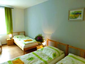 Ein Bett oder Betten in einem Zimmer der Unterkunft Ubytovanie na Frantšachte