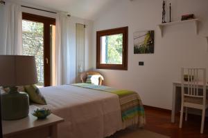 Posteľ alebo postele v izbe v ubytovaní Ca da Muntà bed and breakfast