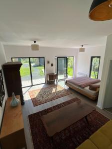 a bedroom with a bed and a fireplace at Rai Village in Băniţa