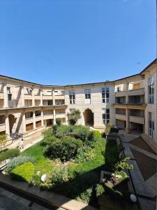 an apartment building with a garden in the courtyard at Premium Apartment in Antigone Luxury and comfort in Montpellier