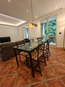 a dining room with a glass table and chairs at Premium Apartment in Antigone Luxury and comfort in Montpellier