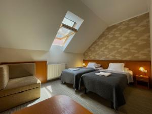 Posteľ alebo postele v izbe v ubytovaní König Hotel