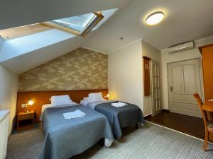 Posteľ alebo postele v izbe v ubytovaní König Hotel