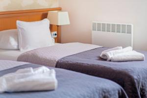 Posteľ alebo postele v izbe v ubytovaní König Hotel