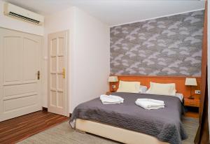 Posteľ alebo postele v izbe v ubytovaní König Hotel