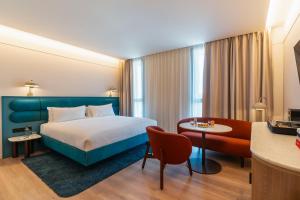 a hotel room with a bed and a table at The Social Hub Barcelona Poblenou in Barcelona