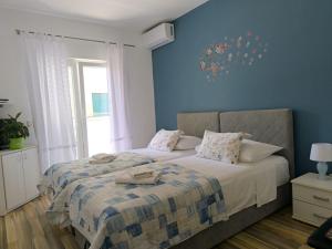 Posteľ alebo postele v izbe v ubytovaní Apartments Desa Petric