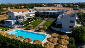 an aerial view of a house with a swimming pool at Marina di Ragusa residence in Marina di Ragusa