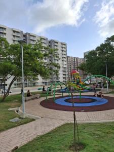 a playground in a park with people sitting around it at Comfort High Speed Internet Fun in Estación El Salto