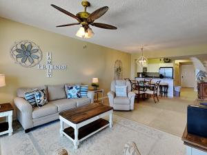 a living room with a couch and a table at Windemere #606 in Perdido Key