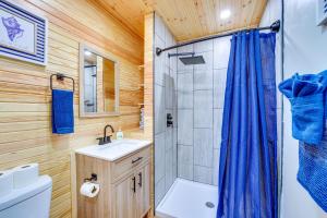 a bathroom with a shower sink and a toilet at Near Table Rock Lake Family Home with Deck and Views in Golden +18 photos