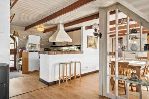 a kitchen and living room with a counter and a table at 378-Hvide-Sande-Sivbjerg-9 in Hvide Sande