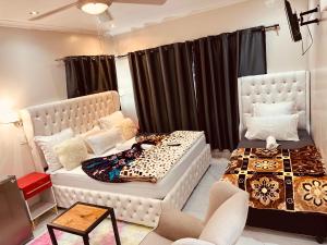 a bedroom with a bed and a bed and a couch at Forest Home Accommodation in De Grendel