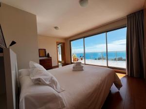 Cama ou camas em um quarto em Homeincalpe Borumbot mais 37 fotos