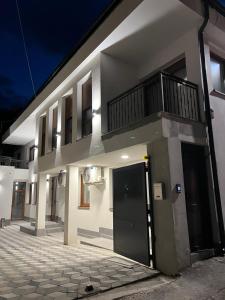a building with a large door and a balcony at AMARIS Suites Sarajevo in Sarajevo