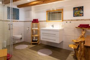 a bathroom with a sink and a toilet at Ferienwohnung Altstadtidylle 2 in Wernigerode +182 photos