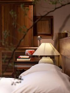 Letto o letti in una camera di Ethnic Hundred-years Elysian Culture&Art Scholar Resorts