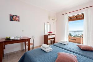 Corfushell Resort Hotel apart客房内的一张或多张床位