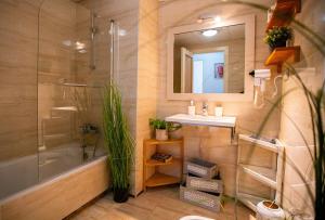 a bathroom with a tub and a sink and a shower at High-End Corner Stay with FREE Parking - Malaga in Málaga