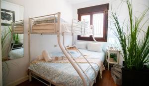 a bedroom with two bunk beds and a bed at High-End Corner Stay with FREE Parking - Malaga in Málaga
