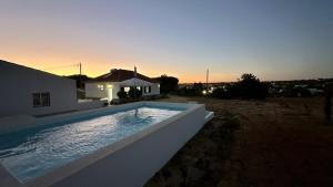 a swimming pool in front of a house at Casa do Monte by Check-in Portugal in Albufeira