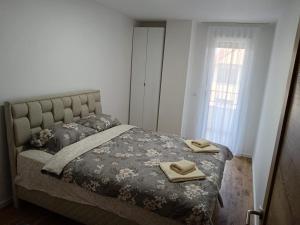 Ένα ή περισσότερα κρεβάτια σε δωμάτιο στο Apartman Julija