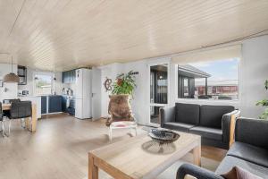 a living room with a couch and a table at 3390-Hvide-Sande-Sivbjerg-57 in Hvide Sande