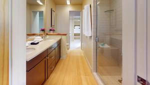 a bathroom with two sinks and a shower at Crestview Condo 25 in Ketchum +23 photos