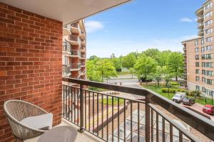 a balcony with chairs and a view of a street at Pentagon City Escape - Contemporary & Comfy in Arlington