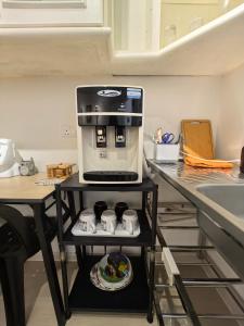 a coffee maker on a shelf in a kitchen at Hiker haven homestay PJ Gasing in Petaling Jaya