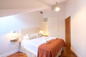 Ein Bett oder Betten in einem Zimmer der Unterkunft La terraza de la Catedral Collection Luxury