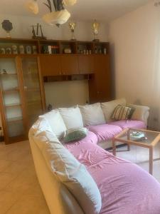 a living room with a couch and a table at Holiday Home Tenuta Santella in Gildone +9 photos