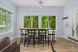 a dining room with a table and some chairs at The Jack Pine - 50 Hollow in Cherry Valley