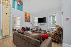 a living room with two couches and a tv at The Jack Pine - 50 Hollow in Cherry Valley