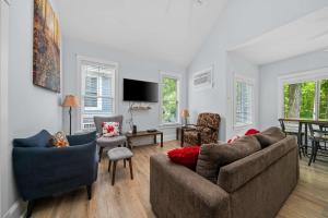 a living room with two couches and a tv at The Jack Pine - 50 Hollow in Cherry Valley +88 photos