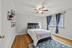 a bedroom with a bed and a ceiling fan at Spacious 3BR Home 5 Mins to Airport and Downtown in Columbus
